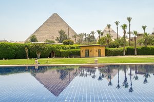 Giza Pyramids Reflected in Luxurious Poolside Oasis