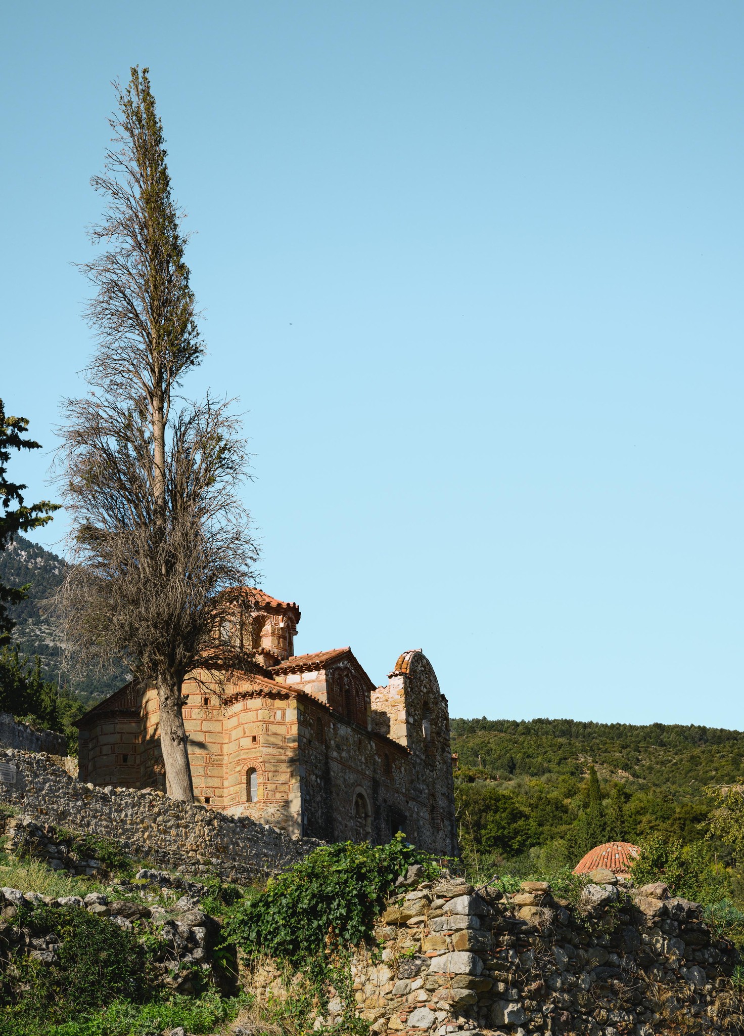 Ancient Stone Church Amidst Greek Hills