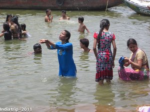 Sacred Dip: Pilgrims Bathing in the Ganges River, India