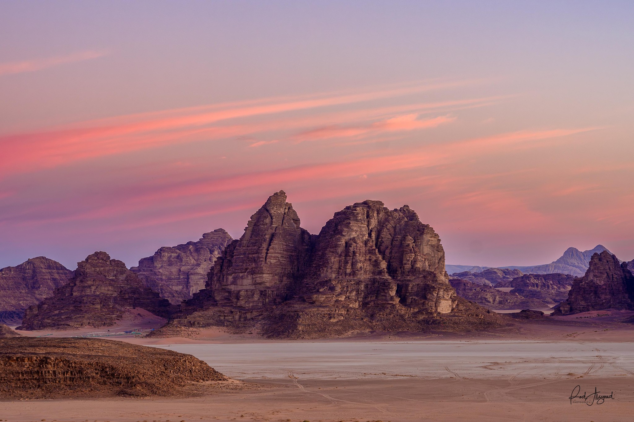 Wadi Rum's Majestic Sandstone Peaks at Sunset