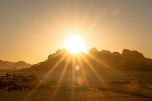 Jordanian Desert Majesty: Sunbeams Over Ancient Landscapes