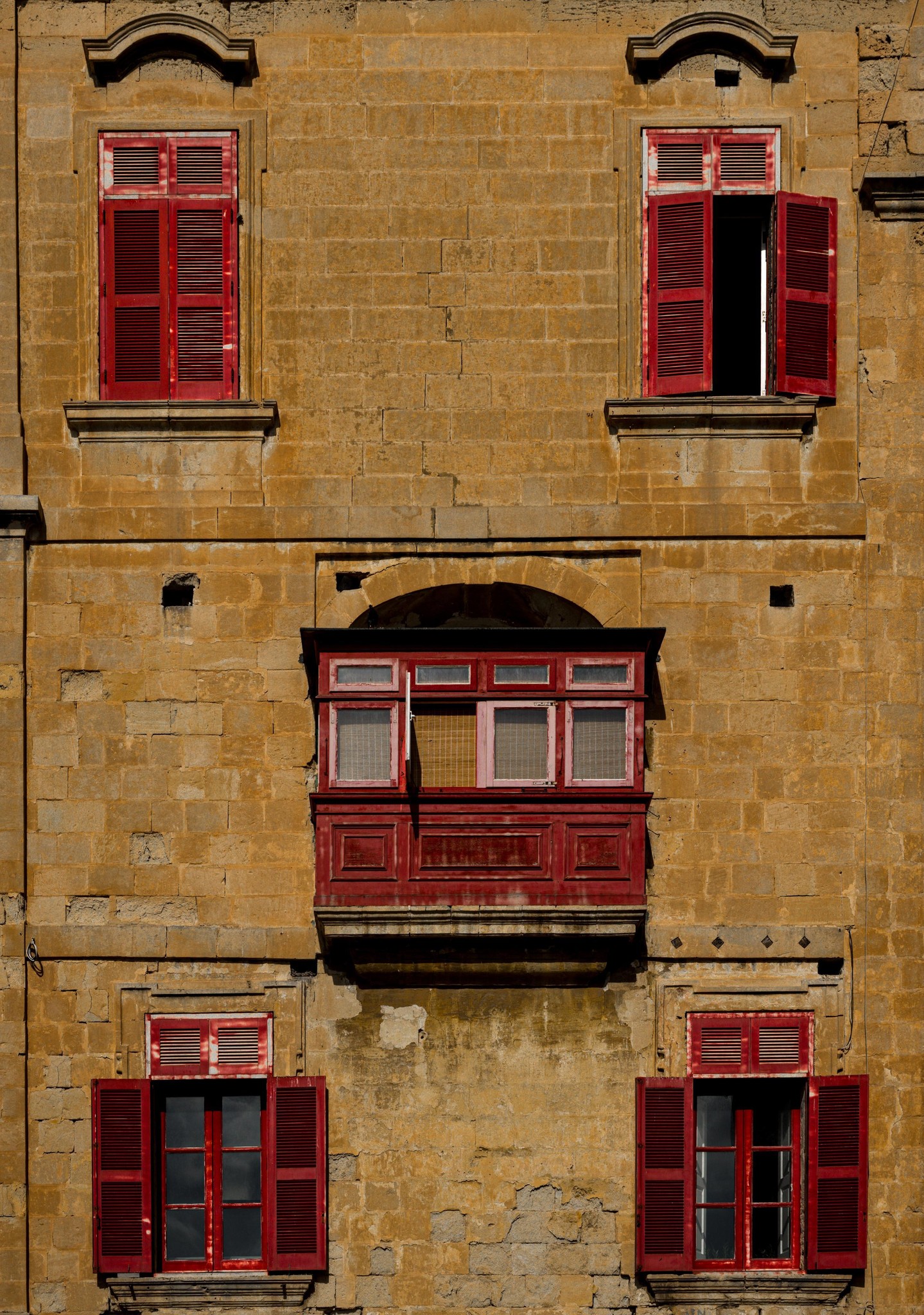 Maltese Architecture: Warm Stone and Vibrant Red Shutters