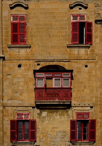 Maltese Architecture: Warm Stone and Vibrant Red Shutters