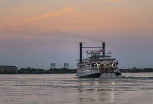 Steamboat Natchez Glides Along the Mississippi at Dusk
