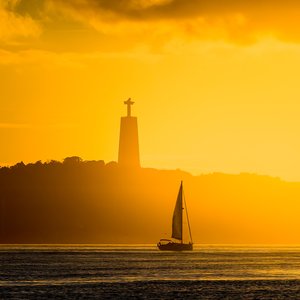 Lisbon Sunset Sail: Christ the King Overlooks the Tagus River