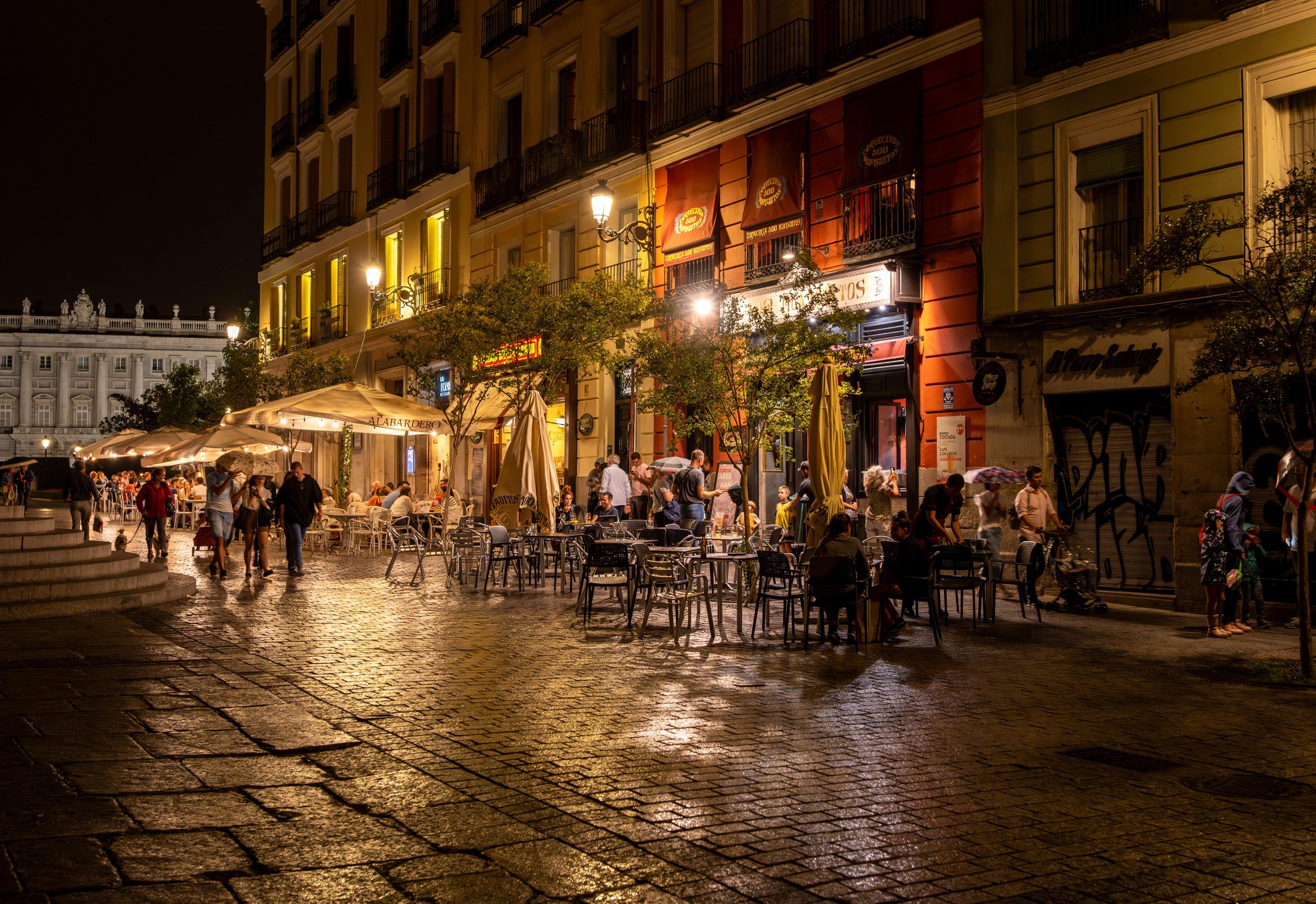 Vibrant Nightlife on a Cobblestone Plaza in Madrid