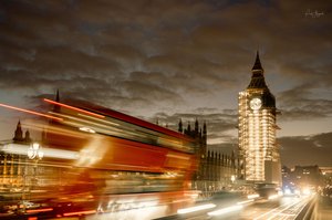 London at Night: Big Ben and Streaking Red Buses